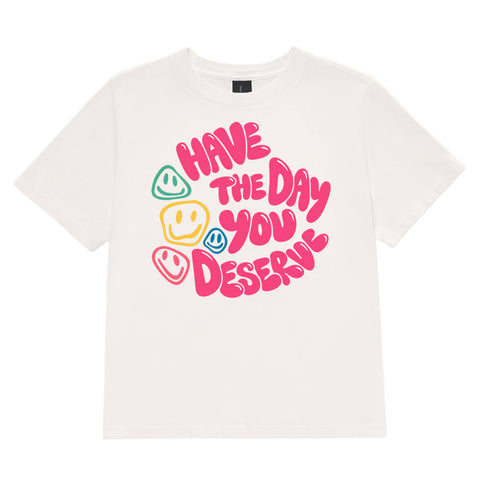 Vintage White women's heavyweight garment-dyed tee, front view with pink Have the Day You Deserve lettering and colourful smiley faces.