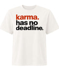 Karma Has No Deadline women's heavyweight garment-dyed tee in Vintage White – front with rust-orange and black lettering, product view 1