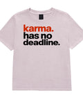 Karma Has No Deadline women's heavyweight garment-dyed tee in Washed Lavender – front with rust-orange and black lettering, product view 2