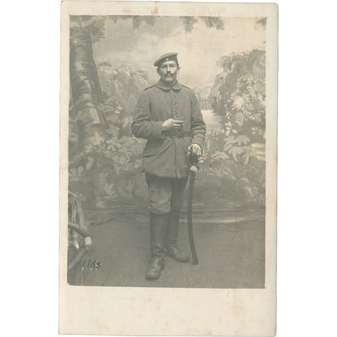 World War I German Soldier holds a sword Photo Postcard