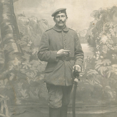 World War I German Soldier holds a sword Photo Postcard