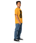 Youth model wearing a Gold One Cat Away youth classic tee, showing the black cat-shaped One Cat Away From Crazy print on the front.
