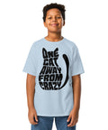 Youth model wearing a Light Blue One Cat Away youth classic tee, showing the black cat-shaped One Cat Away From Crazy print on the front.