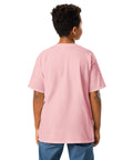 Youth model wearing a Light Pink One Cat Away youth classic tee, showing the plain back.