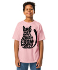 Youth model wearing a Light Pink One Cat Away youth classic tee, showing the black cat-shaped One Cat Away From Crazy print on the front.
