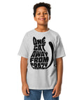 Youth model wearing a Sport Grey One Cat Away youth classic tee, showing the black cat-shaped One Cat Away From Crazy print on the front.