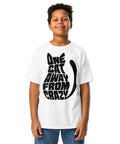 Youth model wearing a White One Cat Away youth classic tee, showing the black cat-shaped One Cat Away From Crazy print on the front.