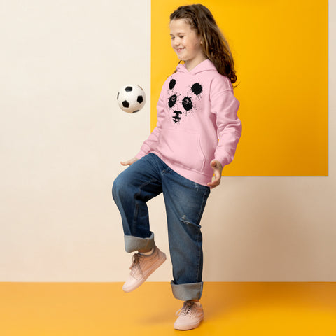 Light Pink youth hoodie worn by a child playing with a football, with the original black ink-splatter panda face on the front.
