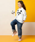 White youth hoodie worn by a child playing with a football, with the original black ink-splatter panda face on the front.