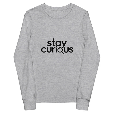 Athletic Heather Stay Curious youth long-sleeve tee with one black magnifying-glass lettering design on the front.
