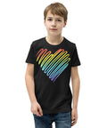 Young model wearing a black Rainbow Heart youth T-shirt, showing one large colourful heart positioned high on the front.