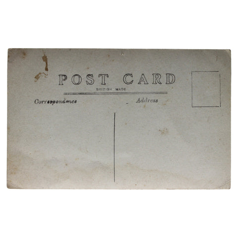 British Soldiers Photo in front of a wooden barracks, World War I Era Postcard