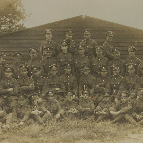 British Soldiers Photo in front of a wooden barracks, World War I Era Postcard
